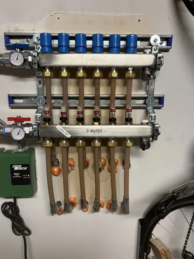 Plumber performing Gas Line Installation at a residential property in New Canaan